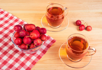Herbal tea and paradise apples, top view
