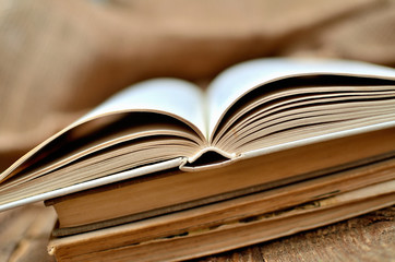 Close-up of old shabby half open book