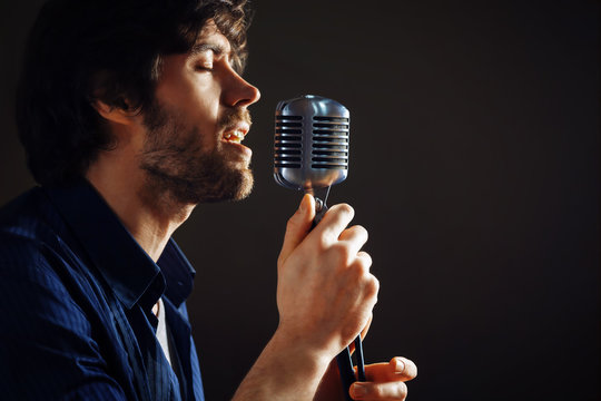 Handsome rock musician singing.