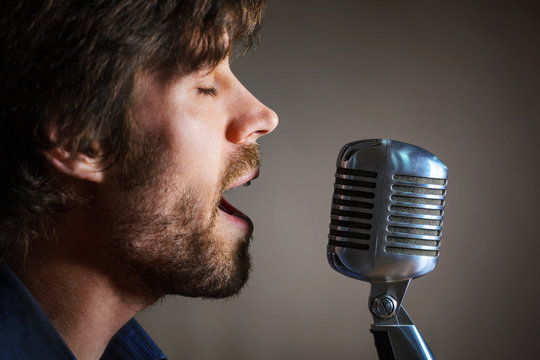 Handsome rock musician singing.