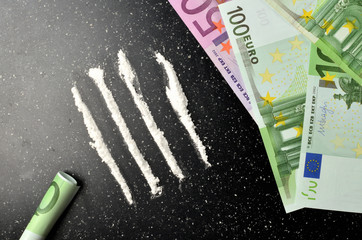 View from above of cocaine and euro banknotes money - illegal drug
