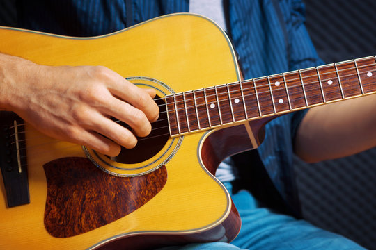 Rock guitarist practicing.