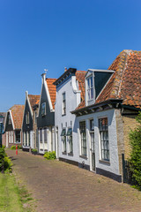 Fototapeta na wymiar Old houses in Oudeschild on Texel island, Netherlands