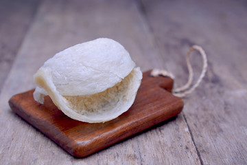 Fresh edible bird's nest on wooden table.