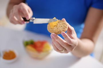 Young Woman Eating Breakfast At Home On Sunday