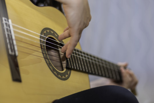 Playing spanish guitar.