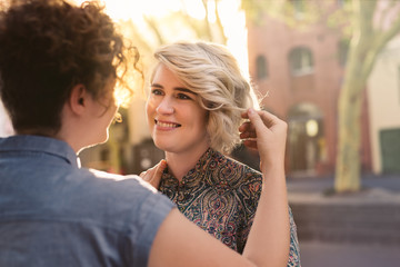 Affectionate young lesbian couple looking into each other's eyes