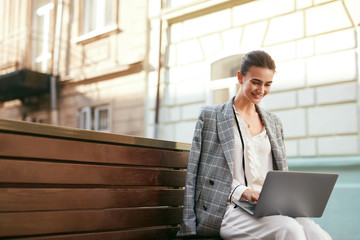 Business Woman Working On Computer At Street 