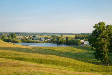 June 30, 2018: Rural landscape with a village, green forests and fields. The village of Mokry. Chuvashia. Russia.