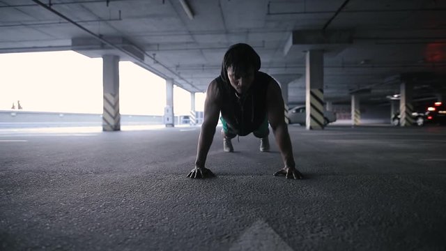 Man push ups in urban place, workout, strength