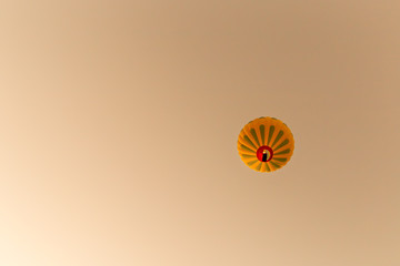 View of Hot air balloons flying in sunset sky