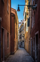 Fototapeta na wymiar View of the colorful Venetian houses on street. Venice, Italy.