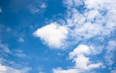Obraz premium white fluffy clouds in the blue sky