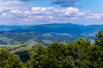 picturesque and beautiful distant blue mountains of Carpathians under the thick clouds