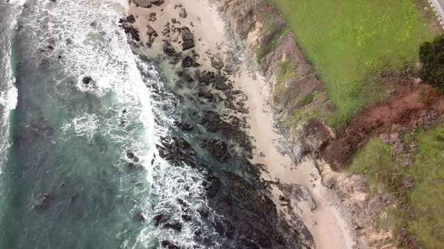 Overhead coastal flyby, Northern California beach