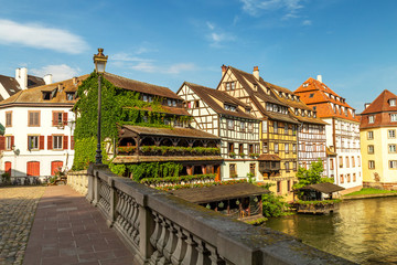 Fototapeta na wymiar Little France (La Petite France), a historic quarter of the city of Strasbourg in eastern France. Charming half-timbered houses.