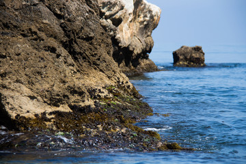 Granada, Spain; June 15, 2018: Rocks in the sea off the coast of Granada