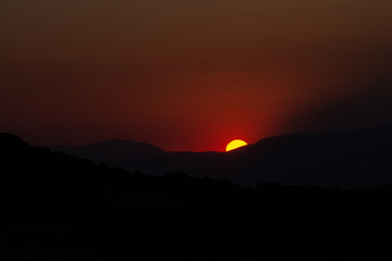 Fototapeta premium Granada, Spain; June 20, 2018: Sunset in the mountains of Granada