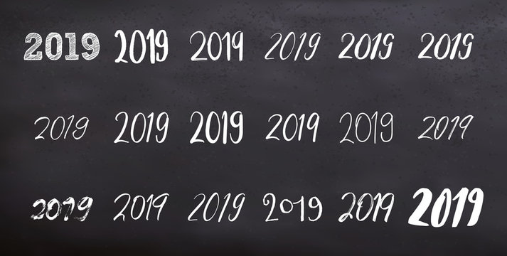 Typography set with calligraphy for 2019 Happy New Year isolated on blackboard. Vector illustration. New year numbers quote