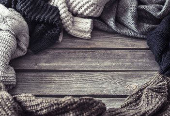 Knitted sweater on a wooden background