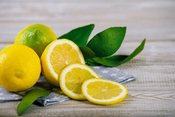 Pile of lemons on old rustic natural wooden table. Retro filter.