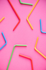 Drinking straws on pink