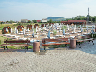 Lounges for relaxation and umbrellas assembled on the pool area