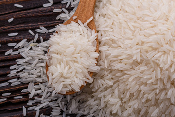 Jasmine rice on a wooden rustic background