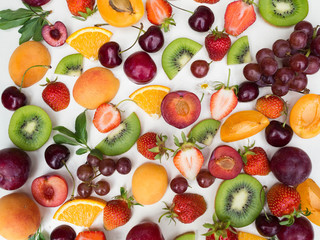 Various fruits background. Colorful different fruits on white background. Top view