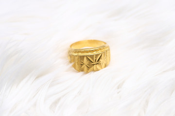 Beautiful gold ring on white background