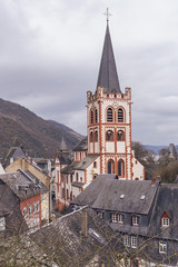 Fototapeta premium beautiful medieval cathedral against the background of mountains and cloudy sky