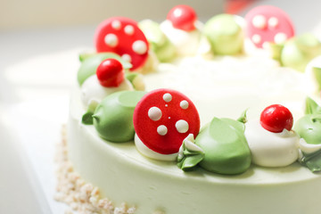 Close up of pandan cake with green color cream and sugar clay.