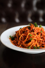 Spaghetti bolognese on wood background , italian food