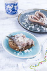 Traditional Dutch herring, with onions. Fat fillets of fish. Healthy food. Healthy food. Copy space,