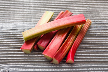 fresh rhubarb on a wooden rustic background