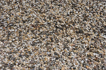 Natural background of small colored pebbles