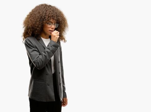 African american business woman wearing glasses feeling unwell and coughing as symptom for cold or bronchitis. Healthcare concept.