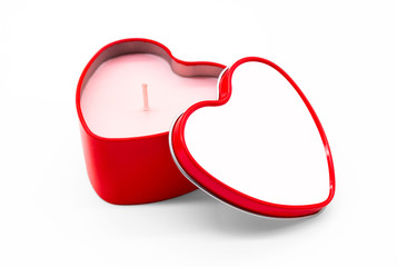 Heart candle in red package on white background.