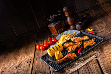 Rustic Grilled chicken wings,legs,and spicy corn