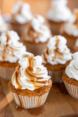 cupcakes or muffins with marshmallow are caramelized. Sweets for the holiday.