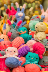 Fototapeta na wymiar colorful handmade knitted small toys for children, background