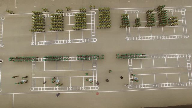 Aerial view. Rewards soldiers. Officers salute the general or commander, receive awards, shoulder straps, medals. Army ready prepares for war. Military parade. Drone, air shoot