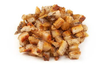 A portion of diced smoked pork fat, ingredient for cooking, isolated on white background. Close-up.