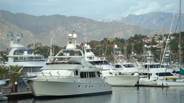 Tropical luxury yacht marina with mountains - port of San Jose del Cabo, Mexico