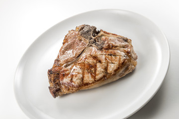 Grilled t-bone chop of pork