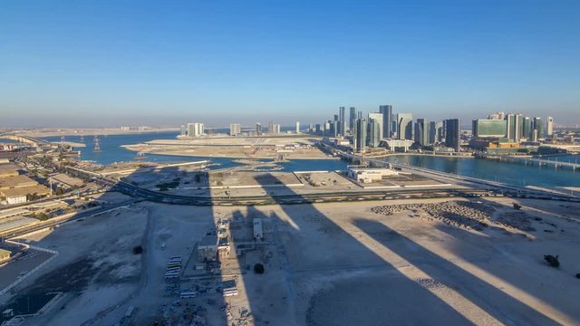Aerial skyline of Abu Dhabi city centre from above timelapse