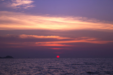 Sunset on the horizon in the sea
