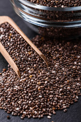 chia seeds on a dark stone background