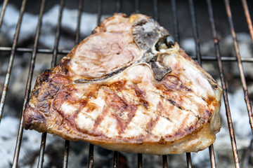 T-bone chop of pork on the grill