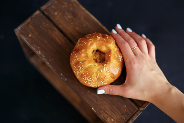 pie in the hands on a black background